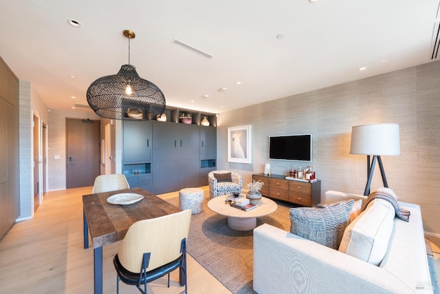 living room with light hardwood / wood-style floors