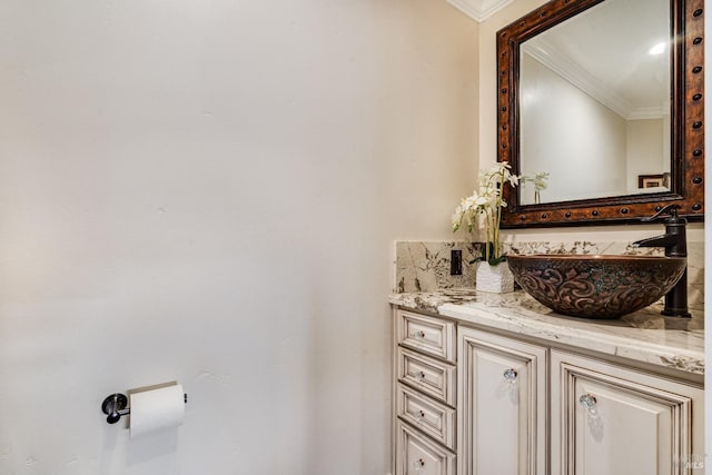 bathroom with vanity and crown molding