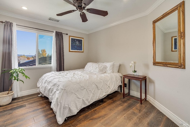 bedroom with ceiling fan, crown molding, and dark wood-type flooring