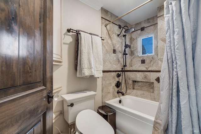 bathroom with shower / bath combo and toilet