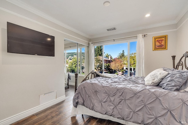 bedroom with crown molding and dark wood-type flooring