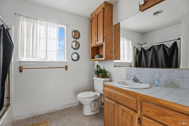 full bathroom with backsplash, tile patterned floors, toilet, vanity, and shower / bathtub combination