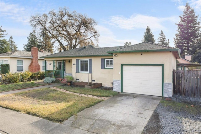 ranch-style home featuring a garage and a front lawn