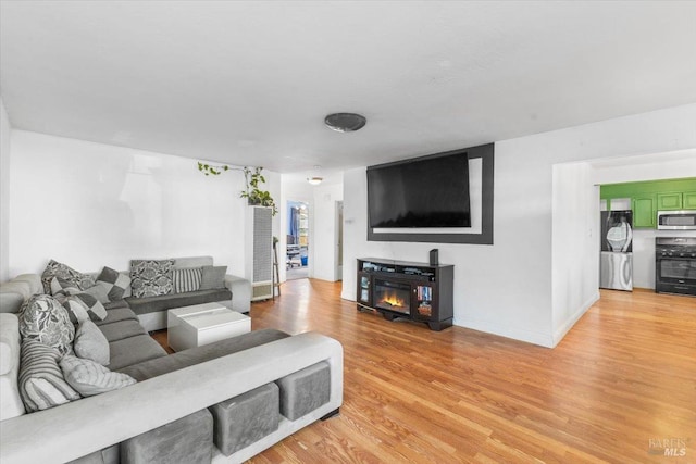 living room with light hardwood / wood-style flooring