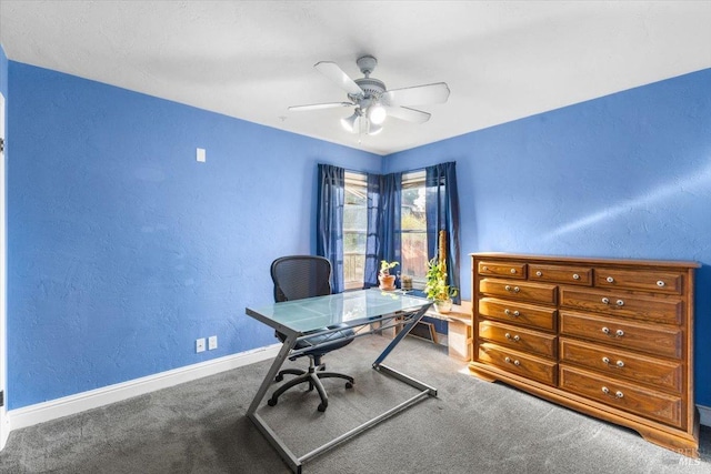 unfurnished office with carpet flooring and ceiling fan