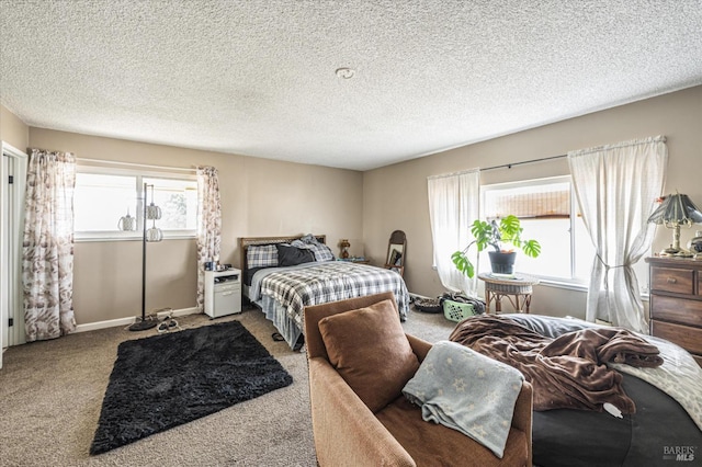 bedroom featuring a textured ceiling and carpet