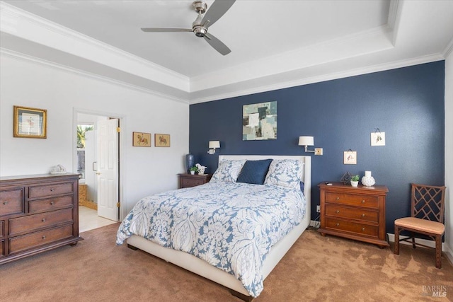 carpeted bedroom featuring a raised ceiling, ornamental molding, and ceiling fan