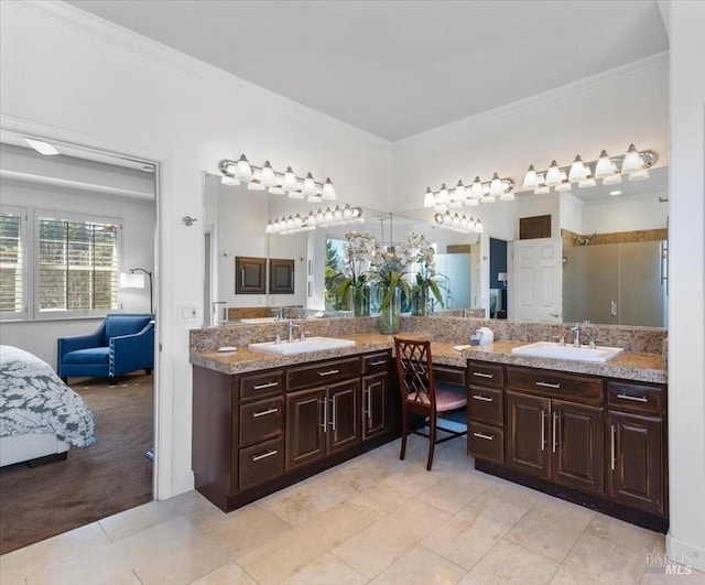 bathroom with ornamental molding, tile patterned flooring, and vanity