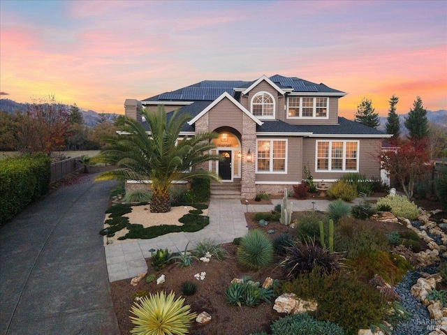 view of front of house featuring solar panels