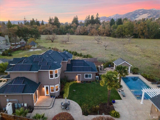 aerial view at dusk with a mountain view