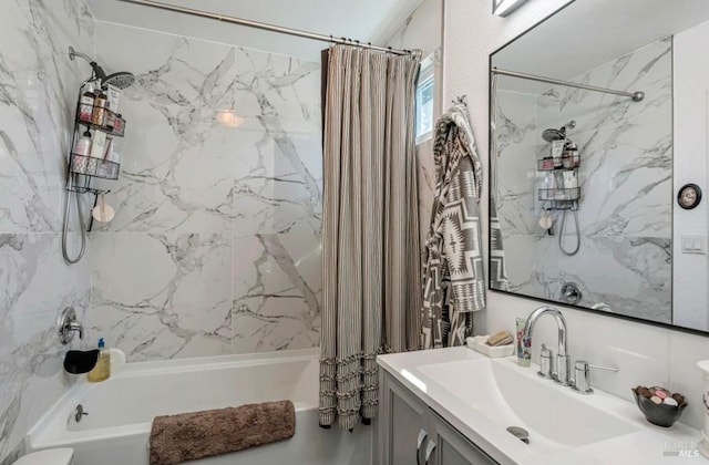 bathroom with vanity and shower / bath combo with shower curtain