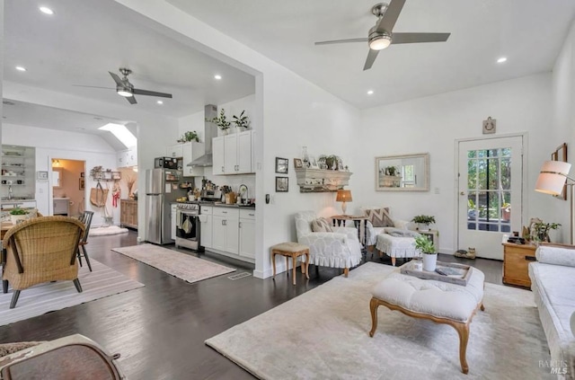 living room with dark hardwood / wood-style floors and ceiling fan