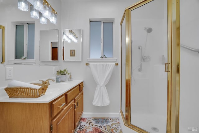 bathroom featuring tile patterned flooring, vanity, and an enclosed shower