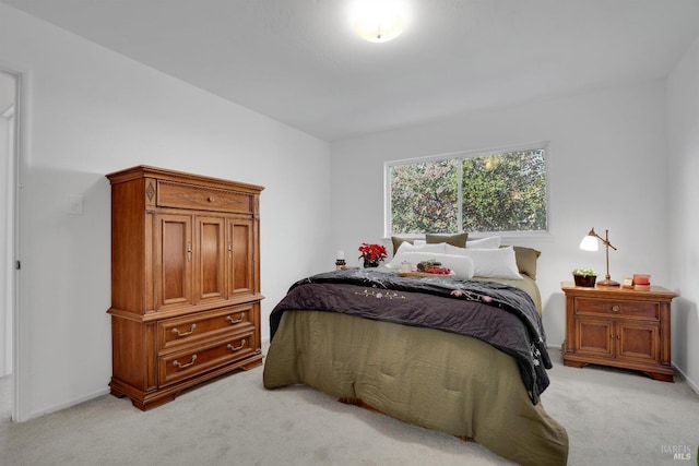 bedroom with light carpet