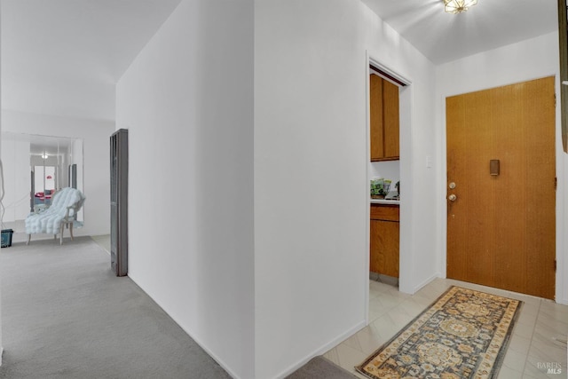 corridor with light colored carpet