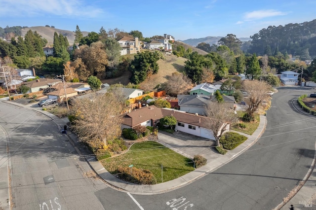 birds eye view of property with a mountain view