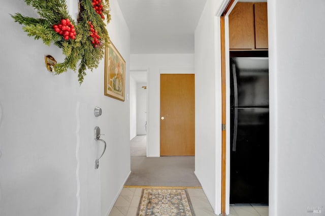 hallway featuring light tile patterned floors