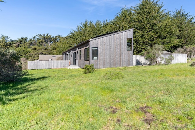 view of home's exterior featuring a yard