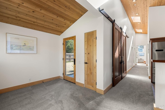 hallway featuring carpet floors, a skylight, high vaulted ceiling, and wooden ceiling