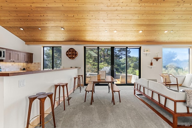 42267 Forecastle, The Sea Ranch, CA 95497 - dining room featuring light colored carpet, recessed lighting, wood ceiling, and healthy amount of natural light