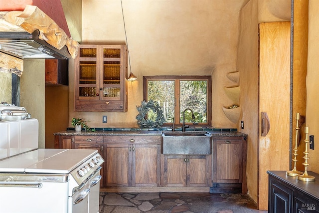 kitchen featuring white range with electric cooktop, sink, and exhaust hood