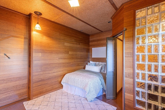 bedroom with wood walls