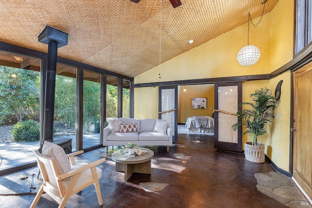 sunroom featuring ceiling fan and lofted ceiling