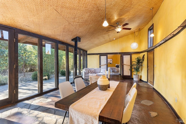 sunroom / solarium with ceiling fan and lofted ceiling