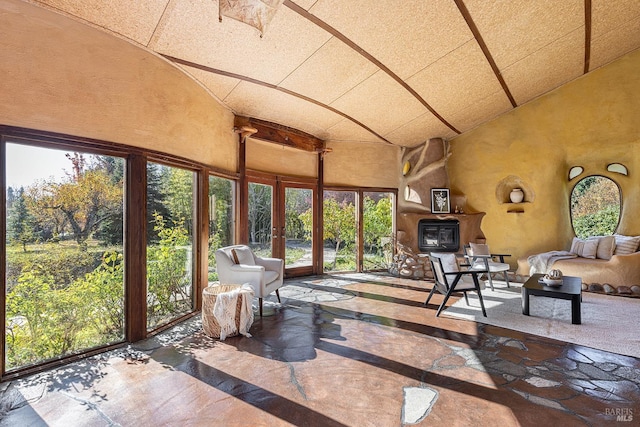 sunroom featuring french doors and a healthy amount of sunlight