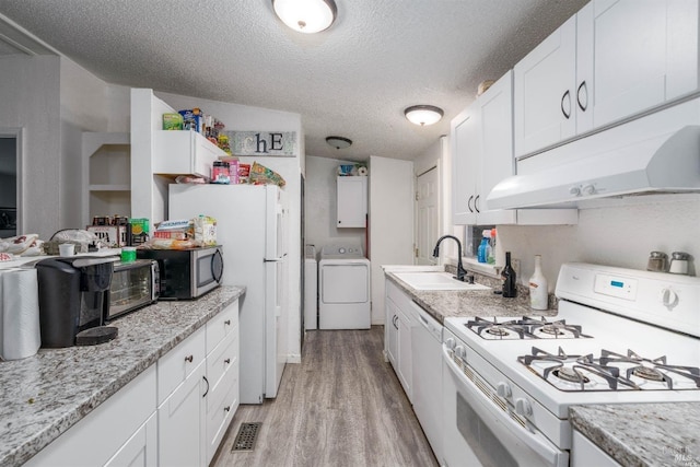 kitchen featuring white cabinetry, sink, light hardwood / wood-style floors, lofted ceiling, and white appliances