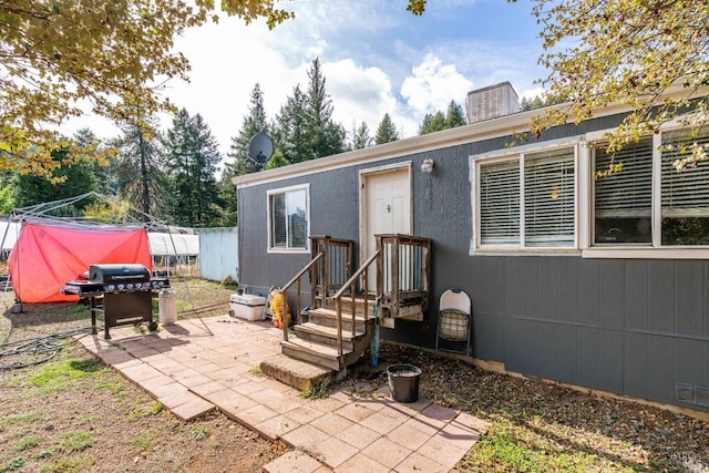 rear view of property featuring a patio