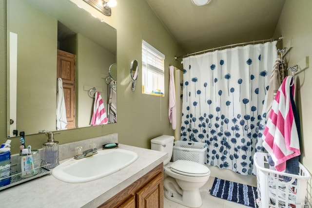 bathroom with tile patterned floors, vanity, a shower with shower curtain, and toilet