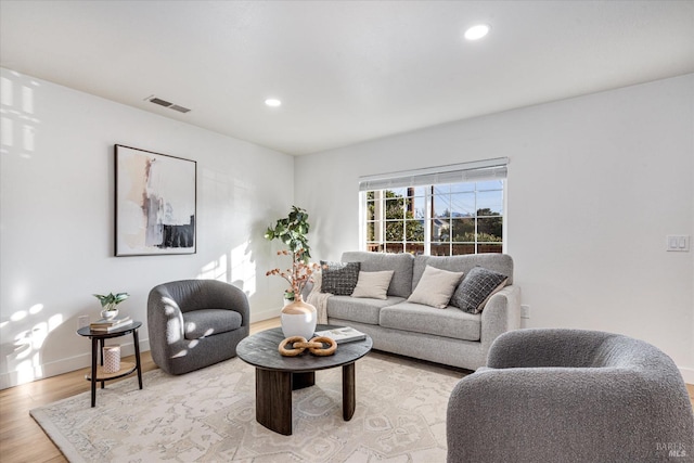 living room with light hardwood / wood-style floors