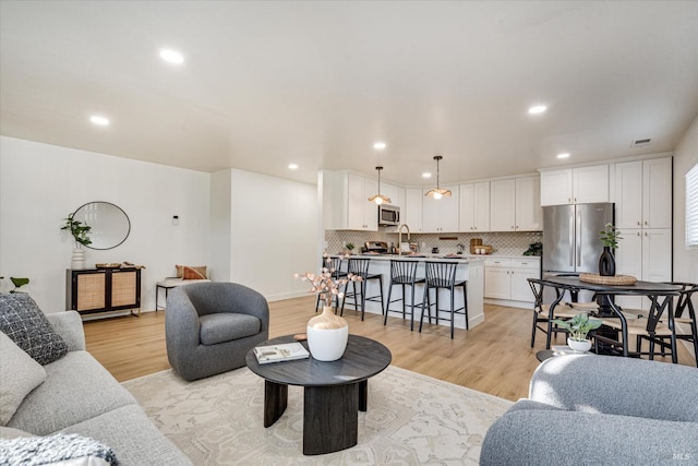 living room with light hardwood / wood-style floors