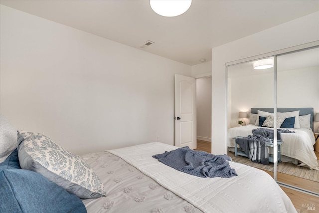 bedroom featuring hardwood / wood-style flooring and a closet