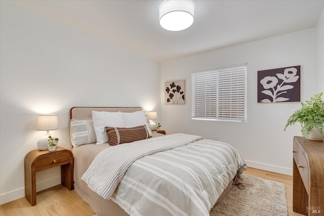 bedroom with light hardwood / wood-style floors