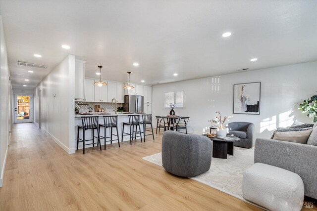 2221 Adrian St, Napa, CA 94558 - living room featuring light wood-style floors, recessed lighting, plenty of natural light, and baseboards