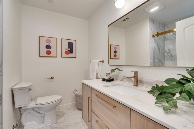 2221 Adrian St, Napa, CA 94558 - bathroom with marble look tile flooring, vanity, toilet, a marble finish shower, and baseboards