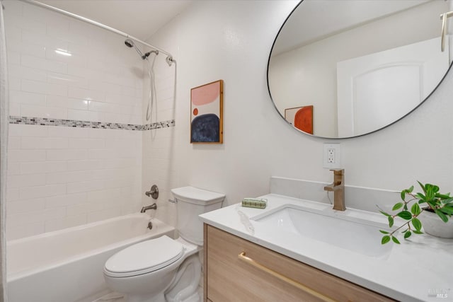 full bathroom featuring vanity, toilet, and tiled shower / bath