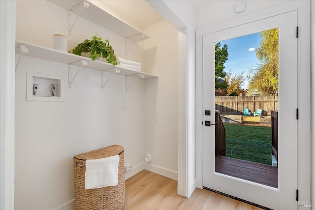 doorway with light hardwood / wood-style flooring