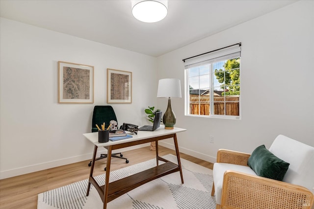 home office with light wood-type flooring