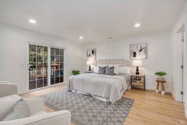 bedroom featuring access to outside and light hardwood / wood-style flooring