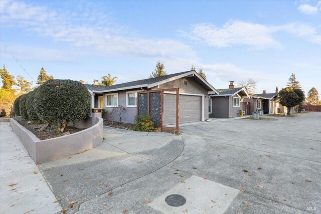 ranch-style house featuring a garage