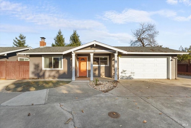 single story home featuring a garage