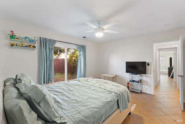 tiled bedroom featuring access to exterior and ceiling fan