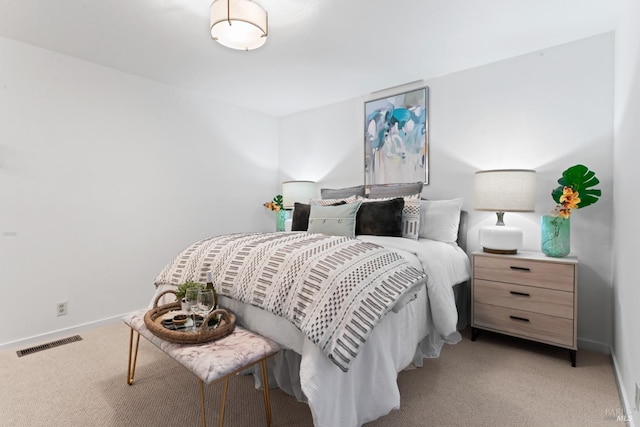 bedroom featuring light carpet