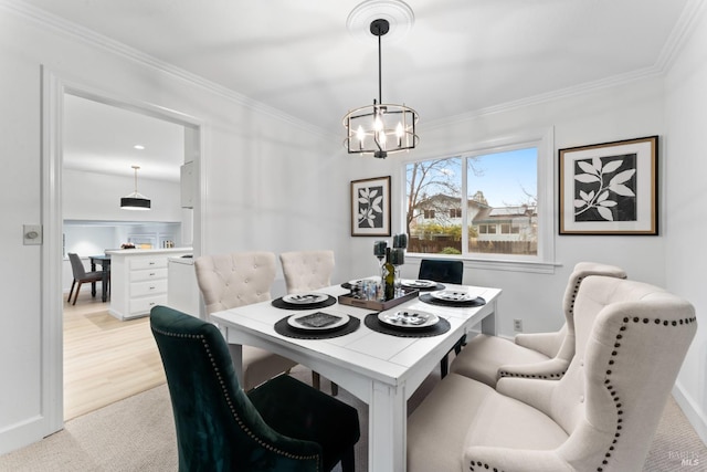 carpeted dining room featuring crown molding and a notable chandelier