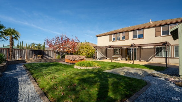 view of yard with a hot tub, a pergola, and a patio area