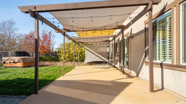 view of patio with a hot tub and a pergola