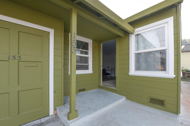 entrance to property with covered porch